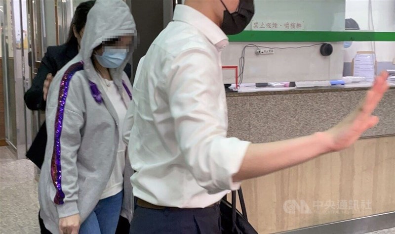 The principal (in gray jacket) of the private preschool is seen in this picture taken in New Taipei when she is released on Thursday. CNA photo June 8, 2023