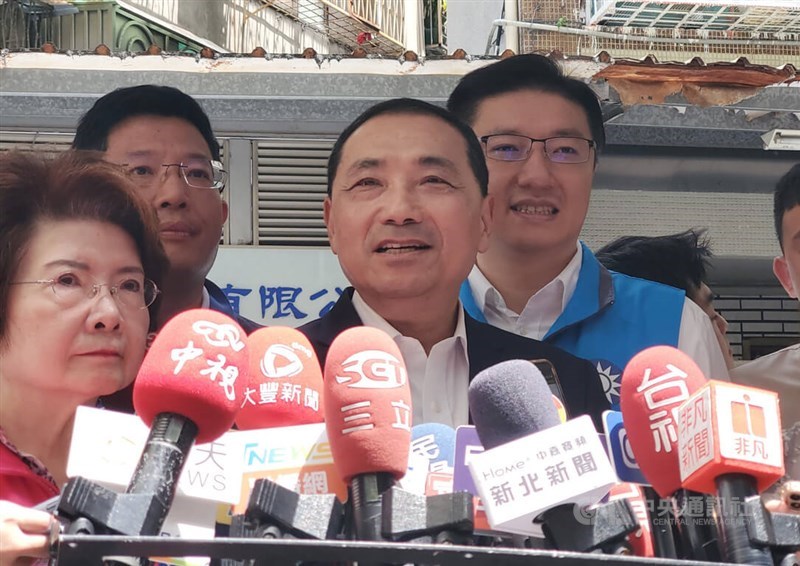 Kuomintang presidential candidate Hou Yu-ih (front, right) takes an interview in Taipei Monday. CNA photo July 3, 2023