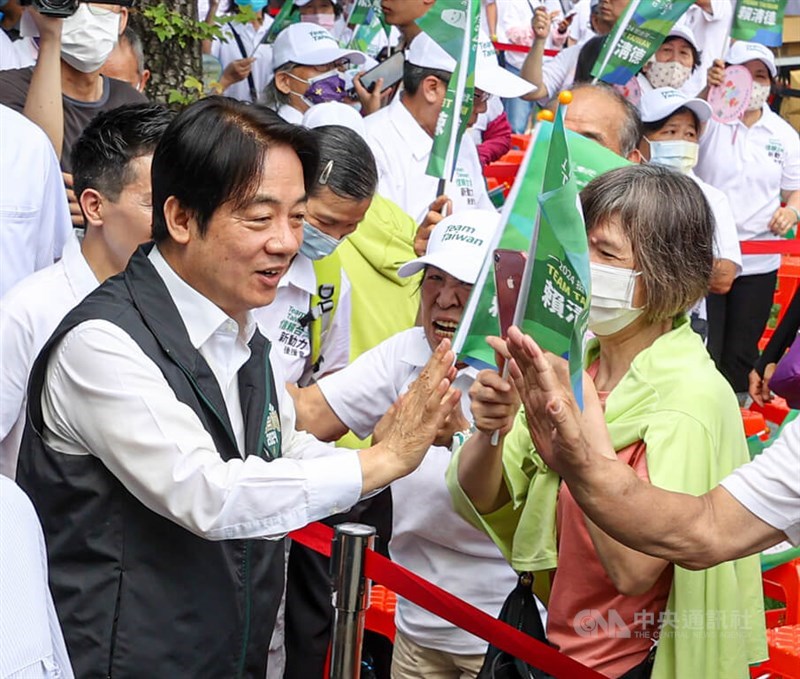 Vice President and DPP presidential nominee Lai Ching-te (left) greets supporters at a campaign rally in Taipei on Sunday. CNA photo July 2, 2023