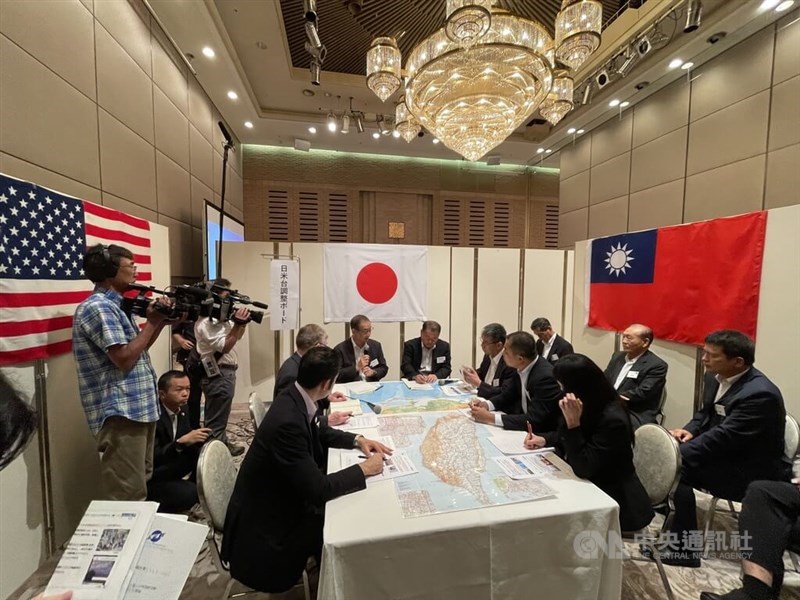 People from Taiwan, Japan and the United States take part in tabletop war games organized by the Japan Forum for Strategic Studies in Tokyo on Sunday. CNA photo July 17, 2022