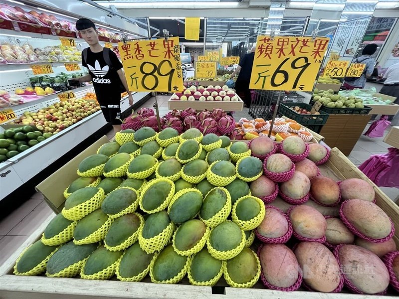 An assortment of mangoes are displayed at a fruits store in Taipei