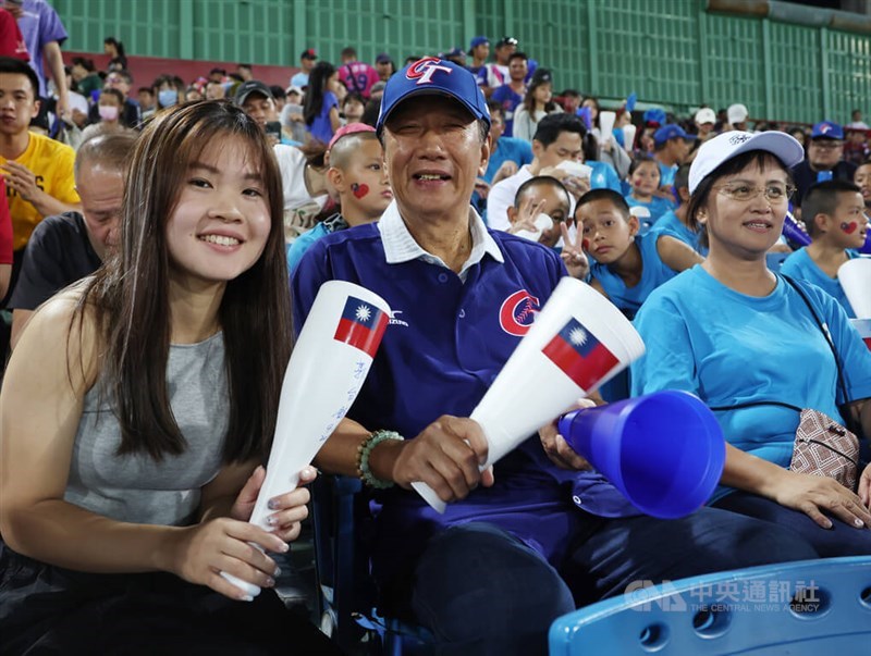 Terry Gou (front second left) cheers for Taiwan