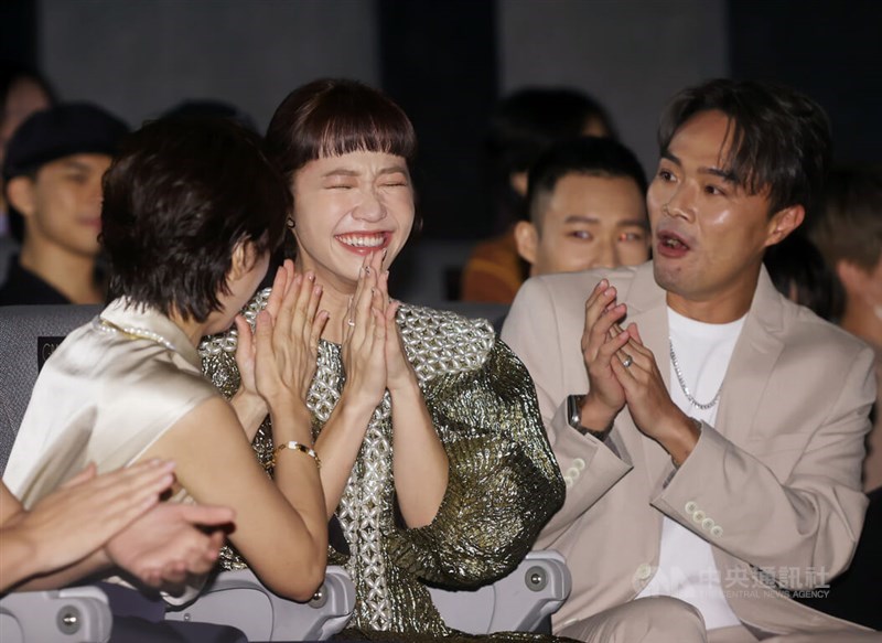 TV show host Lu Lu (second left) reacts with joy after she received two nominations in the variety show host category when attending the news conference held to announce this year