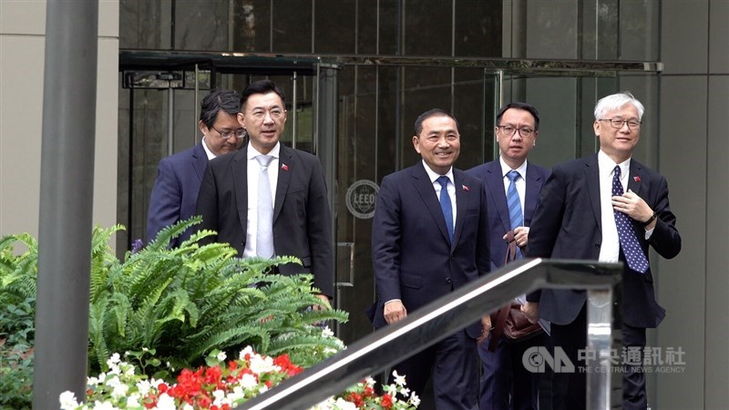 The opposition Kuomintang presidential candidate, New Taipei Mayor Hou Yu-ih (center), KMT Vice Chairman Andrew Hsia (first from right) and lawmaker Johnny Chiang (second from left) are seen at the headquarters office of the American Institute in Taiwan in Washington on Monday. CNA photo Sept. 19, 2023