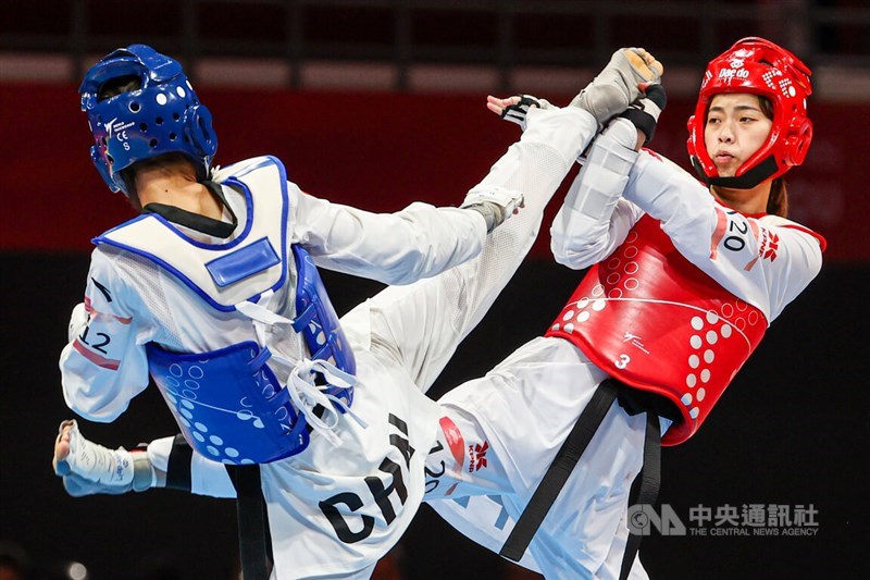 Tokyo Olympics medalist Lo Chia-ling (in red gear) battles her Chinese opponent Luo Zongshi at the taekwondo women