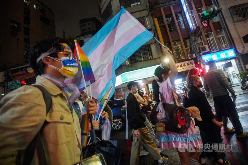 People wave rainbow flags and walk on the street for the the annual Taiwan Trans March that was held on Oct. 28, 2022. CNA file photo Oct. 28, 2022
