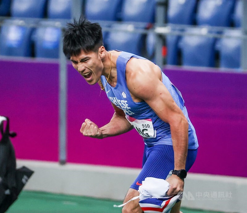 Taiwanese sprinter Yang Chun-han cheers after seeing his third-place finish, which secured a bronze, Taiwan