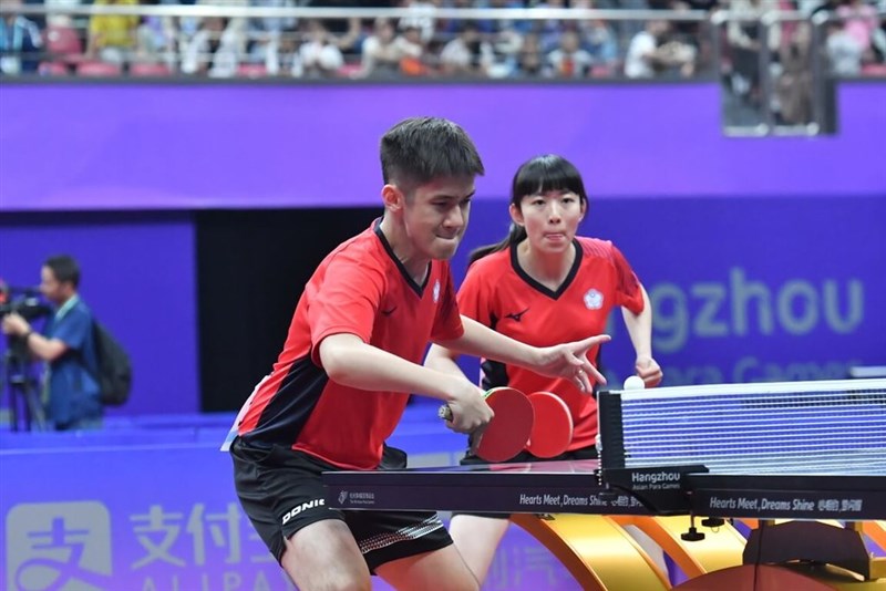 Taiwan's Lin Chun-ting (left) and Lin Tzu-yu compete in a table tennis match during the Asian Paralympic Games held in Hangzhou, China on Friday. Photo courtesy of Sports Administration Oct. 27, 2023