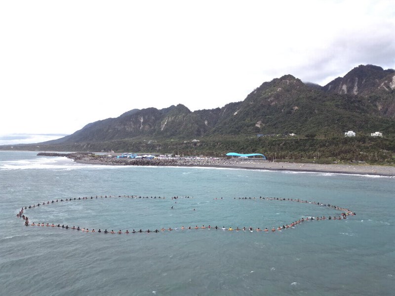 Over 100 competitors take part in a "paddle out" ceremony off the coast of Taitung County Saturday in memory of Indonesian professional surfer Febri Ansyah, who died in a scooter crash on Friday. Photo courtesy of Taitung County government Nov. 11, 2023