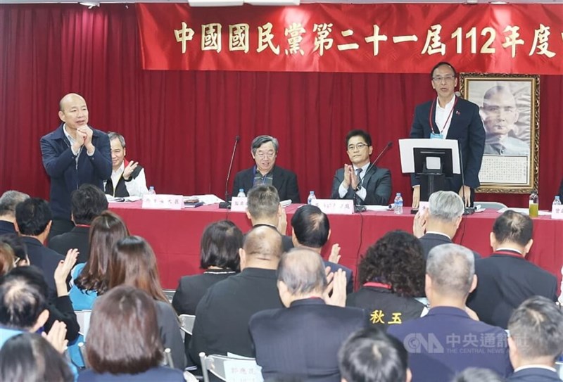 Former Kaohsiung Mayor Han Kuo-yu (left) stand up and greets party members a KMT Chairman Eric Chu (right, standing) formally introduces nominees on the party list of at-large seats in the Legislature in Taipei on Sunday. CNA photo Nov. 19, 2023