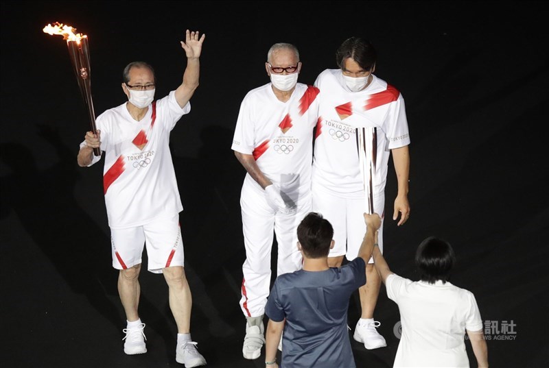 Sadaharu Oh (left) holds the Olympic torch during the Tokyo Summer Games opening ceremony on July, 23, 2021. CNA file photo