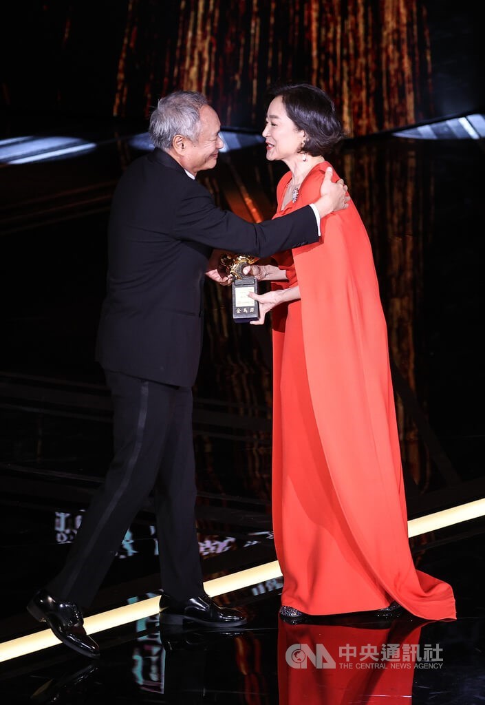 Actress Brigitte Lin (right) receives the 60th Golden Horse lifetime achievement award from film director Ang Lee at the awards ceremony in Taipei Saturday. CNA photo Nov. 25, 2023