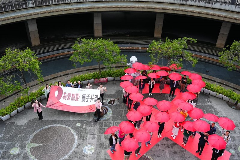 People hold red umbrellas to form a red ribbon at Da'an Park in Taipei Wednesday to mark Dec. 1 World AIDS Day. Photo courtesy of the Centers for Disease Control Nov. 29, 2023