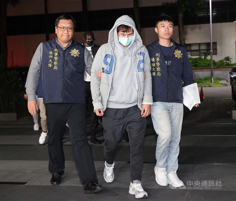 Police officers escort former Dinos player Ko Min-hao (center) to the Shilin District Prosecutors Office for question on Nov. 17, 2023. CNA file photo