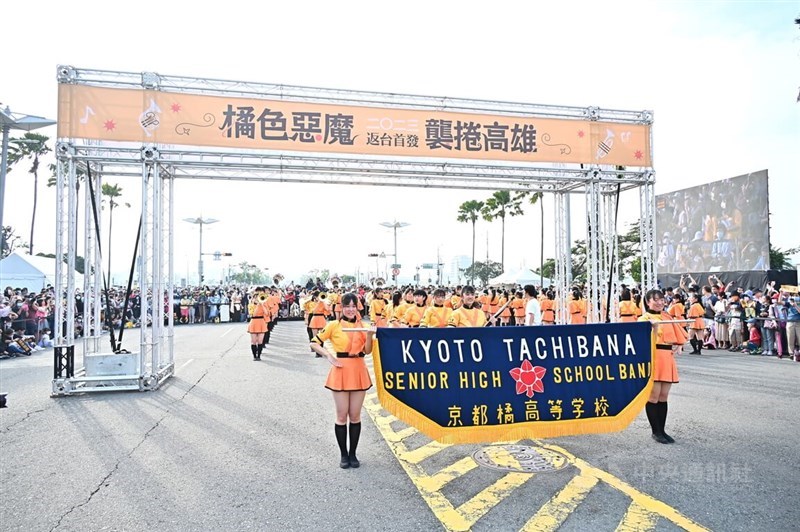 Members of Japan's Kyoto Tachibana Senior High School marching band get ready to wow a crowd of around 85,000 audience on Kaohsiung's Shidai Boulevard Sunday with pop song "We're All in This Together". CNA photo Dec. 10, 2023