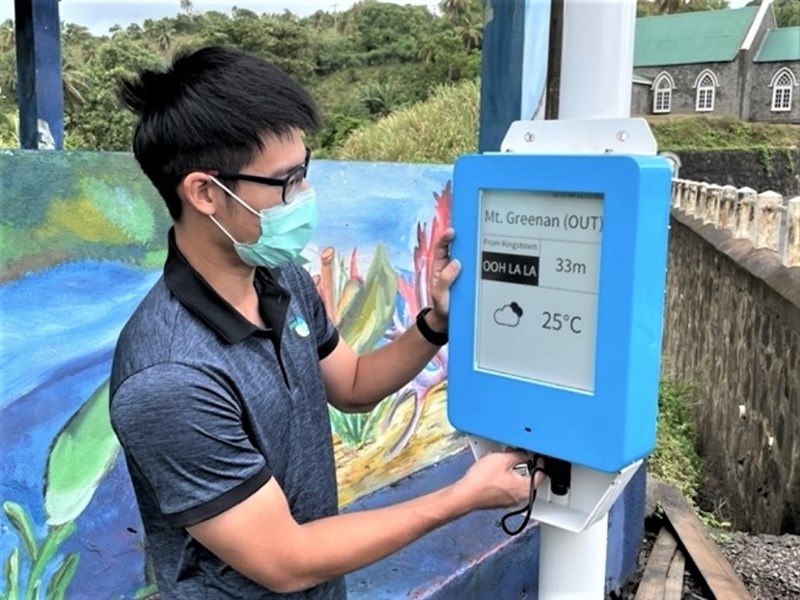 A member of Taiwan's Technical Mission in Saint Vincent and the Grenadines works on one of the smart bus stops developed for the Caribbean country. Photo courtesy of International Cooperation and Development Fund