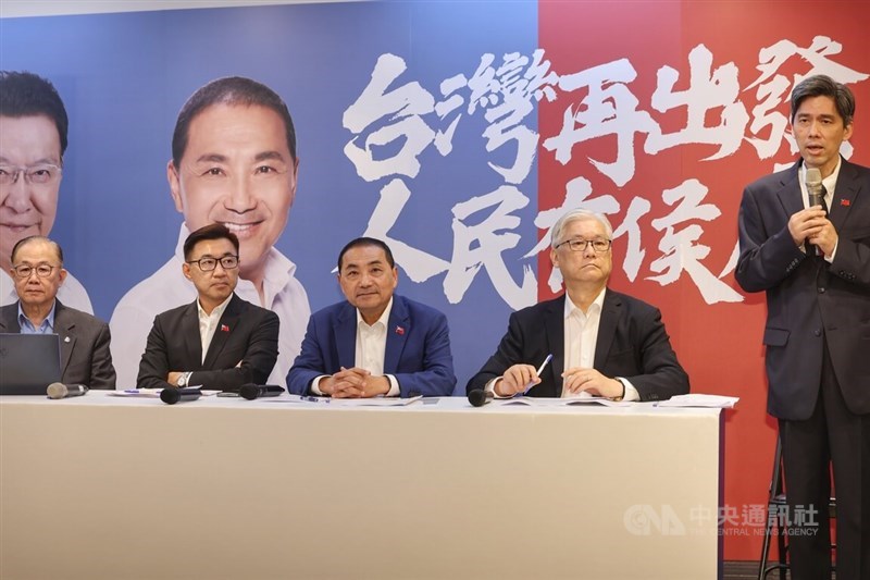KMT Vice Chairman Andrew Hsia (second right) attends a press conference with KMT presidential candidate Hou Yu-ih (center) and lawmaker Chiang Chi-chen (second left) on Monday in New Taipei. CNA photo Dec. 11, 2023
