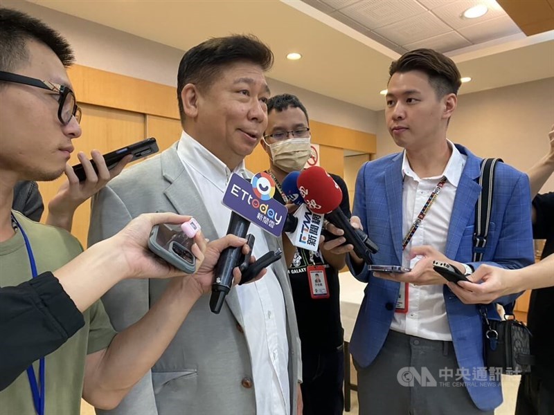 Former Kuomintang lawmaker Chang Hsien-yao (in grey jacket) is interviewed by reporters in Taipei on Aug. 4, 2023. CNA file photo