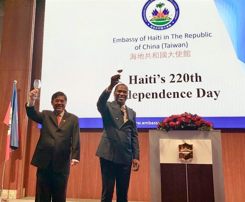 Vice Minister of Foreign Affairs Remus Chen (left) and Haiti's ambassador to Taiwan Roudy Stanley Penn (right) raise their glasses at the celebration. Photo courtesy of Ministry of Foreign Affairs Jan. 12, 2024