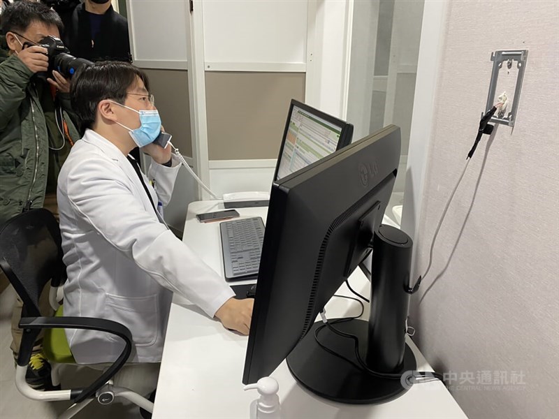 A doctor conducts remote consultation with his patient in this CNA file photo