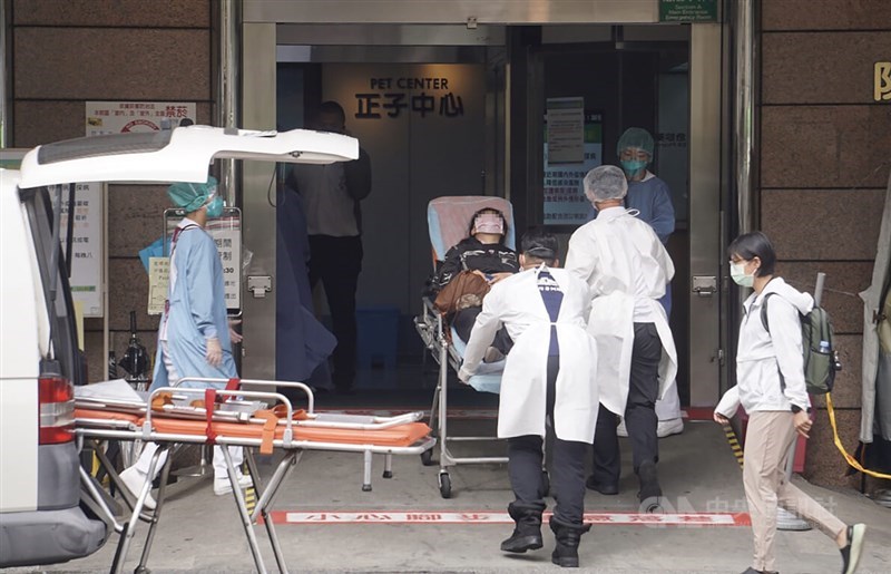 Medical professionals escort a man into a hospital in this CNA file photo