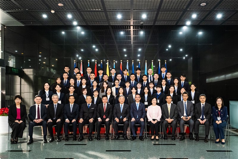 Deputy Foreign Minister Tien Chung-kwang (seventh left in front row) and other Ministry of Foreign Affairs officials pose with the most recent class of diplomat recruits, consisting of more women than men, in this undated photo. Photo courtesy of Ministry of Foreign Affairs