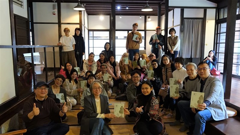 Attendees of the book launch for Grass: There is a Time to Wither and Spring, and a Time to Sprout Again, pose for a group photo, with Ririn Arumsari, one of the migrant writers at the second front right in mid-January. Photo courtesy of National Museum of Taiwan Literature Jan. 16, 2024