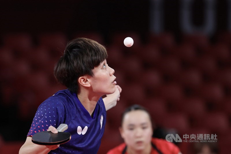 Taiwanese veteran table tennis player Cheng I-ching (in blue) competes in the women's group event at Tokyo Olympics on Aug. 2, 2021. CNA file photo