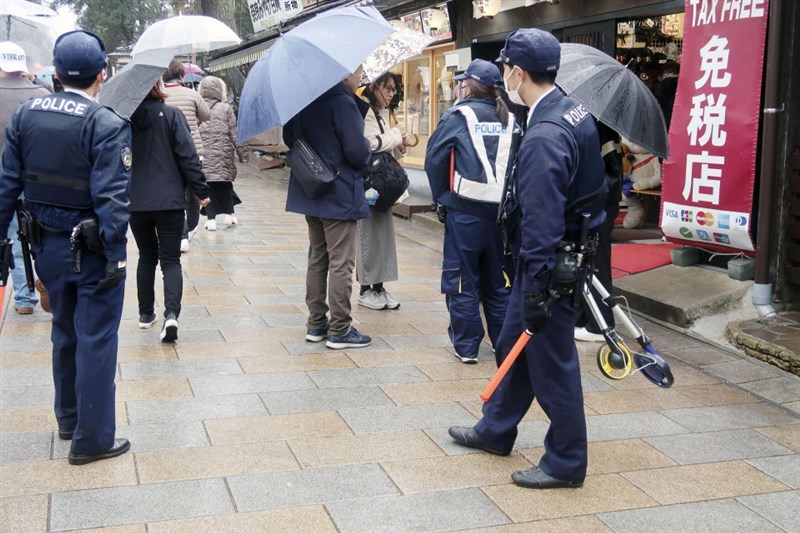 Police officers gather information around the accident site near Todaiji temple in Nara, western Japan. Photo: Kyodo News