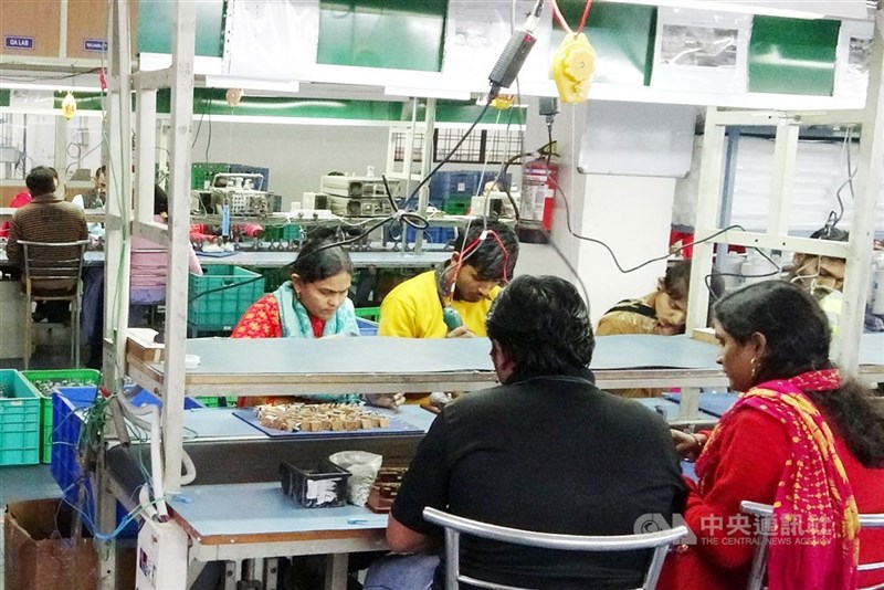 Indian workers are seen in a factory operated by a Taiwanese tech firm in Gurugram, India in this photo taken in December 2021. CNA file photo