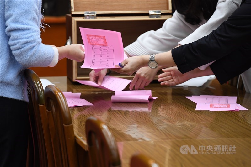 Staff count votes in the election for the heads of the Finance Committee. CNA photo Feb. 29, 2024