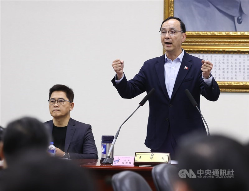 KMT Chairman Eric Chu (right) speaks at the party's weekly Central Standing Committee meeting, during which the reorganization plan was passed, in Taipei Wednesday. CNA photo March 6, 2024