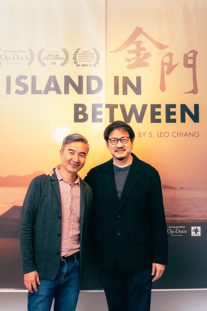 "Island in Between" director S. Leo Chiang (left) and CNEX CEO Ben Tsiang (right) pose in front of a poster for the documentary in this undated photo. Photo courtesy of CNEX