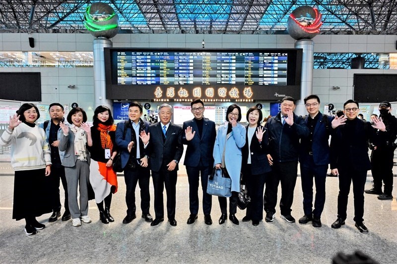 Deputy Legilsative Speaker Johnny Chiang (sixth right) and lawmakers pose for a group photo at Taiwan Taoyuan International Airport before heading to Tokyo on Sunday. CNA photo March 10, 2024