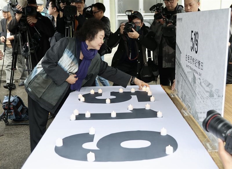 National Human Rights Commission Chairperson Chen Chu places a candle at the press conference at the National Human Rights Museum site in New Taipei Monday.