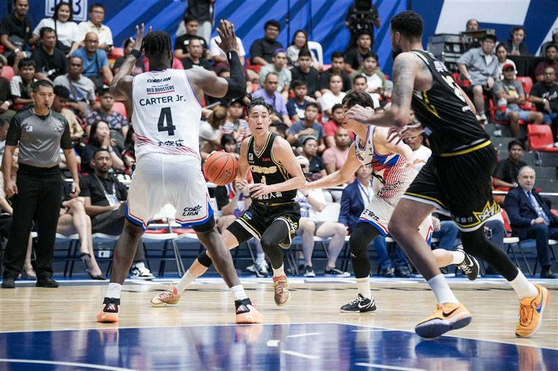 Joseph Lin (with ball) dribbles in Sunday's game in the Philippines. Photo courtesy of EASL March 10, 2024
