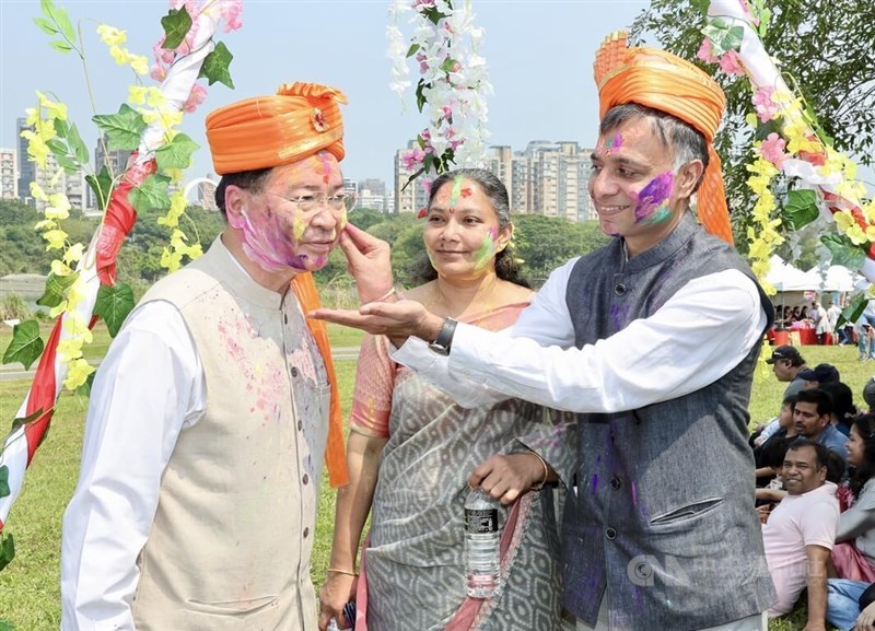 Manharsinh Laxmanbhai Yadav, head of the India Taipei Association engage with Foreign Minister Joseph Wu at the latter's first-ever Holi experience at a New Taipei park on Sunday. CNA photo March 17, 2024