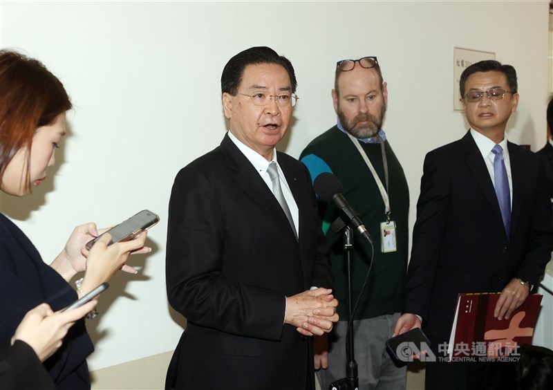 Foreign Minister Joseph Wu (center) speaks to the media before a meeting at the Legislative Yuan Wednesday. CNA photo March 20, 2024