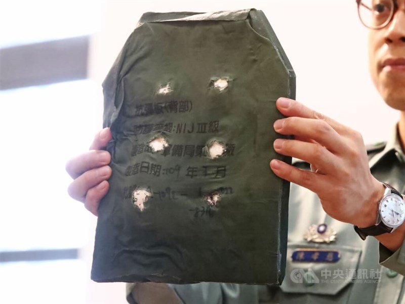 A military officer displays a ballistic plate currently used by the armed forces. CNA file photo