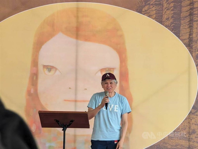 Japanese artist Yoshitomo Nara speaks at the opening press event held for his solo exhibition in Penghu County Thursday. CNA photo March 28, 2024