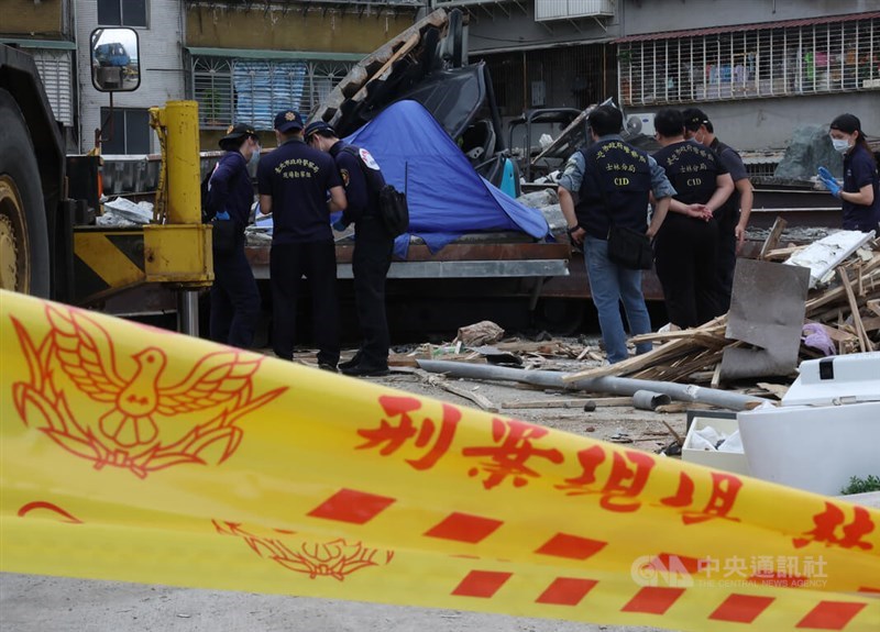 Law enforcement officers inspect a Shilin construction site which collapsed Saturday. CNA photo March 30, 2024