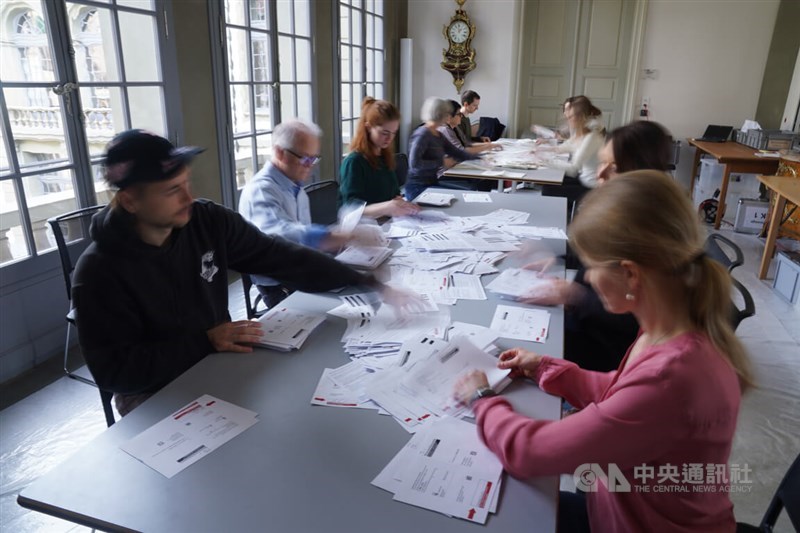Election workers prepared the cast ballots for county in the Swiss capital of Bern on March 3, 2024. Photo: CNA