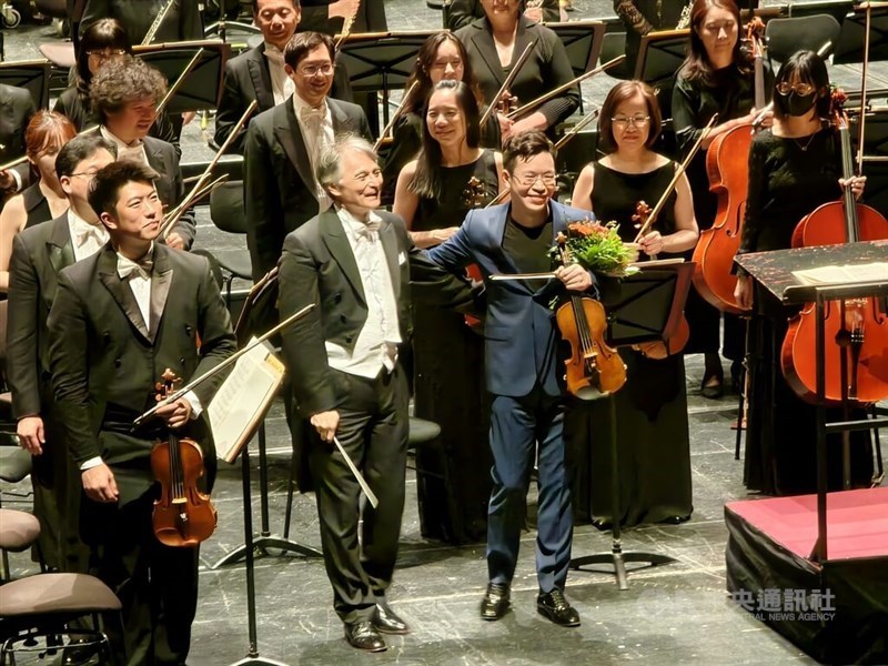 The National Symphony Orchestra, led by Music Director Jun Märkl (front second right), take a call after their performance at Staatstheater Braunschweig in Germany on Sunday. CNA photo April 7