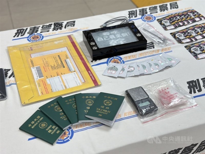 Taiwan passports are exhibited as evidence by Taiwan's Criminal Investigation Bureau on Friday. Alongside the passports are other items such as an envelope used to smuggle the passports out of Taiwan for illegal use. April 12, 2024