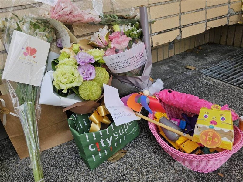 Toys, cards and flowers are laid outside Taipei City Hall on March 18, 2024, following a boy's death in the care of a licensed babysitter. CNA file photo
