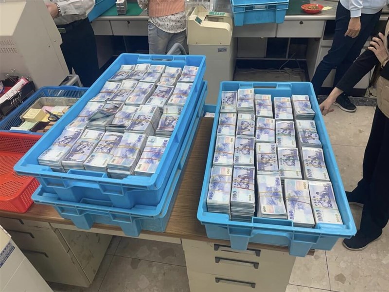 Cash of NT$49 million is seized during a police raid in this undated photo. Photo: New Taipei City Police Department's Criminal Investigation Corps