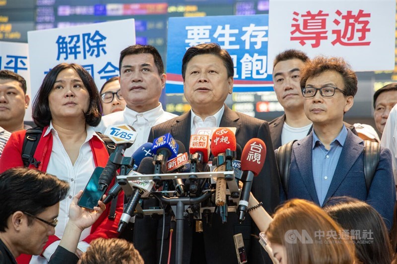 KMT legislative caucus whip Fu Kun-chi (front, second right) speaks to reporters at Taiwan Taoyuan International Airport on Friday. CNA photo April 26, 2024