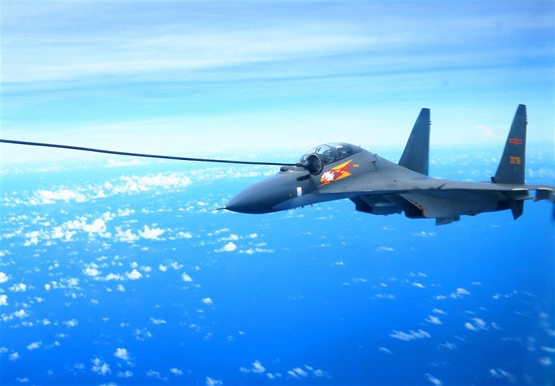A Chinese Sukhoi Su-30 aircraft is refueled mid-air in this photo released in September 2016 by China News Service.