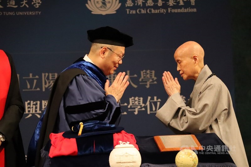 Buddhist Compassion Relief Tzu Chi Foundation founder Cheng Yen (right) and National Yang Ming Chiao Tung University Lin Chi-hung greet each other during a ceremony in Hualien County Sunday. CNA photo May 12, 2024