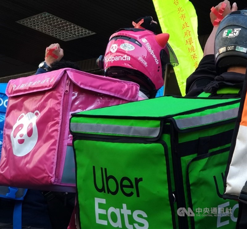 Delivery workers, including some working for Uber Eats and foodpanda, take part in a protest calling for better protection of their rights in 2021. CNA file photo